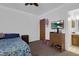 Bedroom with ceiling fan, natural light, and a view of the en suite bathroom at 1800 Red Rock Dr, Pahrump, NV 89048