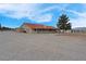 Sprawling single-story home with a red tile roof and ample parking space at 1800 Red Rock Dr, Pahrump, NV 89048