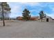 View of house on a big lot, featuring a red tile roof and mature trees at 1800 Red Rock Dr, Pahrump, NV 89048