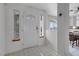 Bright entryway featuring neutral tile floors, natural light from windows, and an ornate security door at 1800 Red Rock Dr, Pahrump, NV 89048
