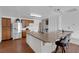 Kitchen and breakfast bar with wood cabinets, stainless steel fridge, and modern appliances at 1800 Red Rock Dr, Pahrump, NV 89048