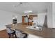 Open kitchen with breakfast bar, wood cabinets, and stainless steel appliances creating a functional space at 1800 Red Rock Dr, Pahrump, NV 89048