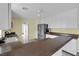 Bright kitchen featuring white cabinetry, stainless steel appliances, and a spacious counter at 1800 Red Rock Dr, Pahrump, NV 89048