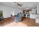 Living room featuring an open floor plan with the kitchen bar and access to other rooms at 1800 Red Rock Dr, Pahrump, NV 89048