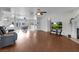 Spacious living room boasting hardwood floors, a ceiling fan, and plenty of natural light at 1800 Red Rock Dr, Pahrump, NV 89048