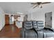 Open floor plan with wood floors, connecting the living room to the kitchen with a breakfast bar at 1800 Red Rock Dr, Pahrump, NV 89048