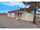 Exterior view of detached outbuilding with a charming red roof and neutral siding at 1800 Red Rock Dr, Pahrump, NV 89048
