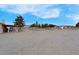 Expansive lot with a partially covered patio and mature trees at 1800 Red Rock Dr, Pahrump, NV 89048