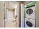 Bright bathroom featuring a shower-over-tub combination and a stacked washer and dryer at 220 E Flamingo Rd # 402, Las Vegas, NV 89169