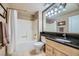 Well-maintained bathroom featuring a shower-tub combo and a large mirror at 220 E Flamingo Rd # 402, Las Vegas, NV 89169