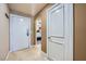 Hallway with neutral colored walls and view into bedroom at 220 E Flamingo Rd # 402, Las Vegas, NV 89169