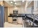 A view of the kitchen with stainless steel appliances and speckled granite countertops at 220 E Flamingo Rd # 402, Las Vegas, NV 89169