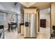 Kitchen featuring stainless steel refrigerator and adjacent dining area at 220 E Flamingo Rd # 402, Las Vegas, NV 89169