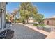 Expansive backyard with patio pavers, mature trees, and outdoor seating area perfect for entertaining at 2288 Red Alder St, Henderson, NV 89002