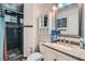 Bathroom with a shower and granite countertops at 2288 Red Alder St, Henderson, NV 89002