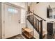 Bright entryway features decorative door glass, hardwood flooring, and a staircase at 2288 Red Alder St, Henderson, NV 89002