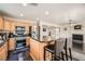 Well-appointed kitchen with a central island, breakfast bar, and modern appliances at 2288 Red Alder St, Henderson, NV 89002