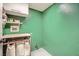 Functional laundry room with storage shelves and space-saving ironing station at 2288 Red Alder St, Henderson, NV 89002