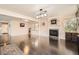 Open-concept living room featuring a fireplace and hardwood floors at 2288 Red Alder St, Henderson, NV 89002