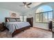 Spacious main bedroom with a large window and a ceiling fan at 2288 Red Alder St, Henderson, NV 89002