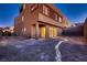 Modern home boasts a low maintenance backyard with sliding glass doors at 261 Crimson Edge St, Henderson, NV 89012