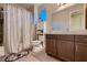 Charming bathroom with a shower-tub combo, modern fixtures, and a convenient storage cabinet at 261 Crimson Edge St, Henderson, NV 89012