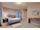 Cozy bedroom with elegant wallpaper, soft lighting, and a comfortable bed with stylish decor at 261 Crimson Edge St, Henderson, NV 89012