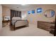 Modern bedroom featuring a stylish bed, contemporary furniture, and a minimalist design at 261 Crimson Edge St, Henderson, NV 89012