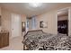 Comfortable bedroom featuring neutral tones, carpet flooring, and a bathroom right next door at 261 Crimson Edge St, Henderson, NV 89012