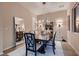 Elegant dining room featuring a modern chandelier and a table set for a formal dinner at 261 Crimson Edge St, Henderson, NV 89012