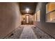 Stylish entryway with tiled pathway, rock landscaping, and large windows at 261 Crimson Edge St, Henderson, NV 89012