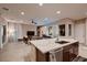 Open-concept kitchen with a large island offering seating and a view into the living area at 261 Crimson Edge St, Henderson, NV 89012