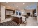 Well-equipped kitchen featuring stainless steel appliances and a central island open to the living area at 261 Crimson Edge St, Henderson, NV 89012