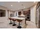 Spacious kitchen island with seating, stainless steel appliances and granite countertops at 261 Crimson Edge St, Henderson, NV 89012