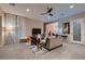 Modern living room with tile floors, stylish furniture, and plenty of natural light at 261 Crimson Edge St, Henderson, NV 89012