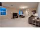 Open-concept living room with carpet flooring, large windows, and comfortable furniture arrangement at 261 Crimson Edge St, Henderson, NV 89012
