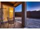 Exterior view of backyard patio area with pavers, rock landscaping, and a privacy wall at 261 Crimson Edge St, Henderson, NV 89012