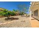 Well-maintained backyard with a pergola-covered patio and xeriscape design at 3021 Lotus Hill Dr, Las Vegas, NV 89134