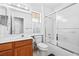 Cozy bathroom features a shower and tub combination, ample vanity storage, and tiled flooring at 3021 Lotus Hill Dr, Las Vegas, NV 89134