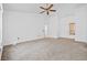 Spacious main bedroom with large windows, a ceiling fan, and neutral color tones at 3021 Lotus Hill Dr, Las Vegas, NV 89134
