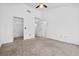 Carpeted bedroom with a vaulted ceiling, closet, and neutral wall color at 3021 Lotus Hill Dr, Las Vegas, NV 89134