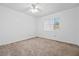 Bright bedroom with neutral carpet, ceiling fan, and natural light from window at 3021 Lotus Hill Dr, Las Vegas, NV 89134