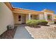 Inviting single-story home featuring a tiled roof and a covered entryway with decorative shrubs at 3021 Lotus Hill Dr, Las Vegas, NV 89134