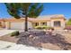 Inviting single story home featuring desert landscaping and a well-manicured front yard at 3021 Lotus Hill Dr, Las Vegas, NV 89134