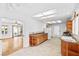 Spacious kitchen layout with white appliances, light cabinets and eat-in breakfast area at 3021 Lotus Hill Dr, Las Vegas, NV 89134