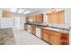 Functional kitchen featuring light cabinets, tile flooring, and modern appliances at 3021 Lotus Hill Dr, Las Vegas, NV 89134