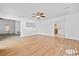 Bright living area with wood floors and seamless flow into other rooms in the home at 3021 Lotus Hill Dr, Las Vegas, NV 89134