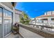 This balcony provides a serene outdoor space with views of lush trees and nearby buildings at 3150 Soft Breezes Dr # 2018, Las Vegas, NV 89128
