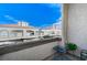 This balcony offers scenic views of the surrounding buildings and clear blue skies above at 3150 Soft Breezes Dr # 2018, Las Vegas, NV 89128