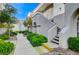 The exterior of this property boasts lush greenery, a well-maintained walkway, and charming architectural details at 3150 Soft Breezes Dr # 2018, Las Vegas, NV 89128